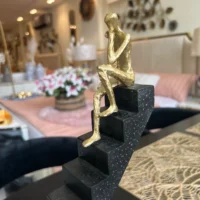 Staircase Sculpture with Gold man