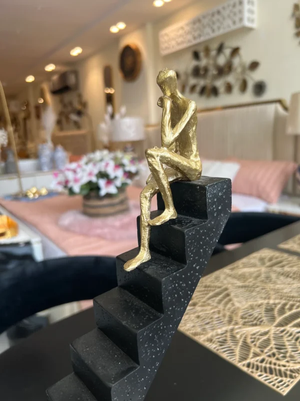 Staircase Sculpture with Gold man